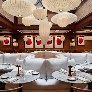 a dining room with a lot of tables and chairs