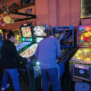 a row of pinball machines