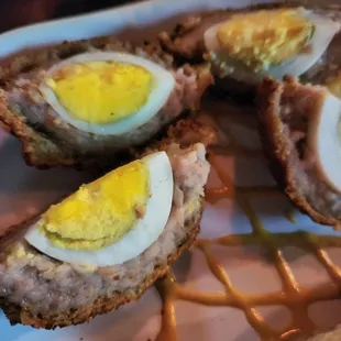a plate of scotch eggs