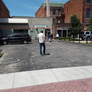 a man standing in a parking lot