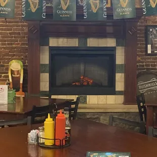 a fireplace and tables