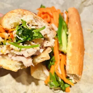 a person&apos;s hand holding a sandwich