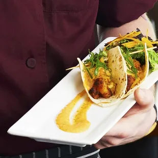 a man holding a plate of food