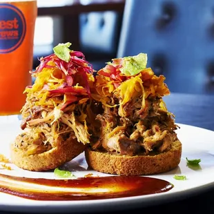 a pulled pork sandwich and a beer