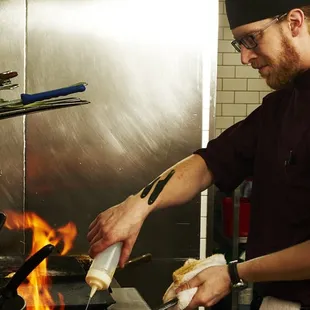 a man cooking in a kitchen