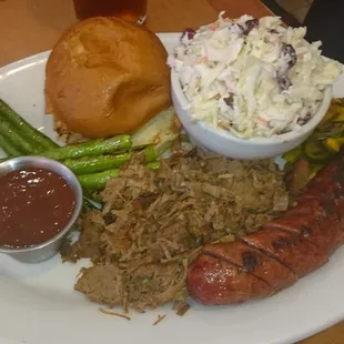Smokehouse BBQ platter with beef brisket, Elk sausage, grilled asparagus &amp; cole slaw.