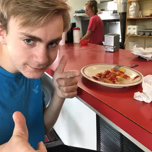 a man giving a thumbs up