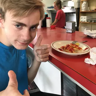 a man giving a thumbs up