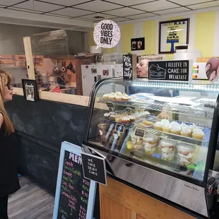 a woman standing in front of the counter