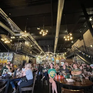 a large group of people sitting at tables