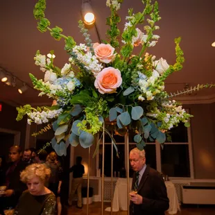 These tall arrangements got so many compliments, and they stayed lovely for a long time after the wedding.
