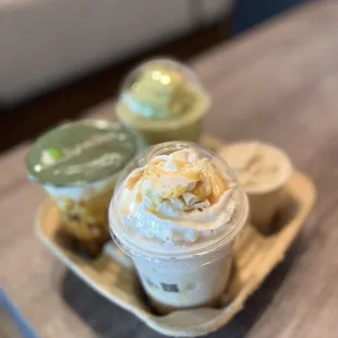 a cup of ice cream and a container of whipped cream