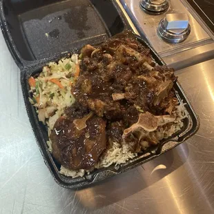 Generous portion of oxtail, rice, and cabbage.