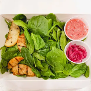 Spinach salad with chilled grilled pears, pickled onions, and a raspberry vinaigrette, 5/5. IG: @take.a.bite.with.me