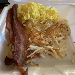 2 scrambled eggs, hash browns, bacon. Yummy &amp; filling! Also came with 2 full pieces of toast