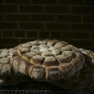 a loaf of bread on a cooling rack