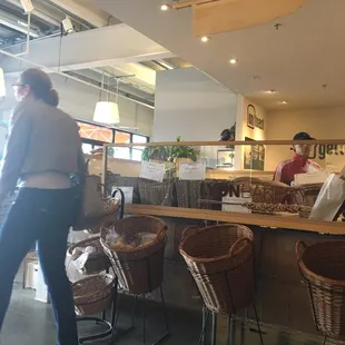 a woman standing in front of the counter
