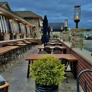 a patio with tables and chairs