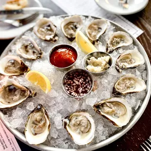 a platter of oysters on ice