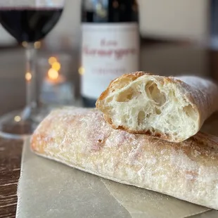 a piece of bread and a glass of wine