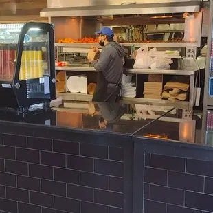 ws a man working in a restaurant