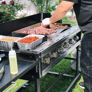 Carne asada tacos are almost ready.