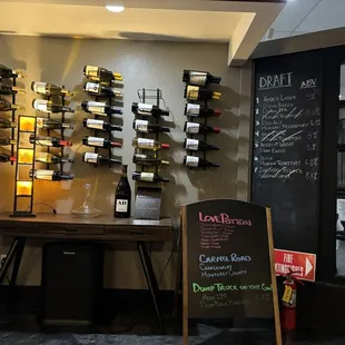 Mounted wine racks near entry