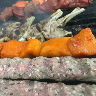 meat and vegetables on a grill