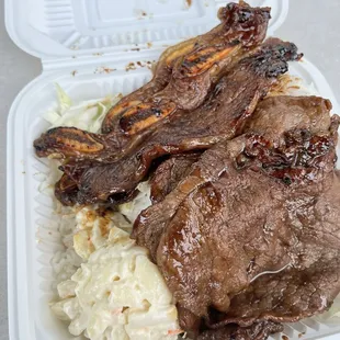 meat and rice in a styrofoam container