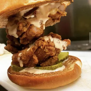 Our &quot;New Market&quot;  boneless fried chicken thigh topped with our bbq aioli and bread and butter pickles