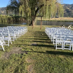 Wedding ceremony seating

*White Padded Chairs
*Rustic Wedding Arch