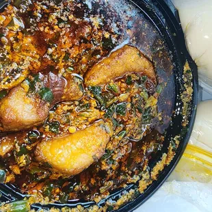 Egusi soup with beef. A little wasted when I took the top off. It was delicious.