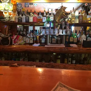 a dollar bill on the bar counter