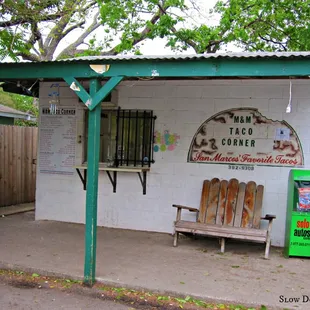 a bench in front of a store