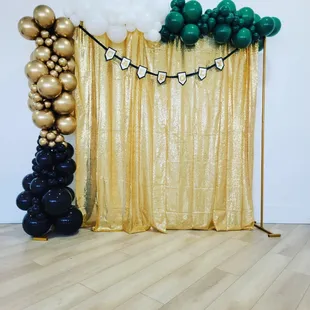Close Up of the Balloon Garland &amp; Gold Sequin Drape with Poles.