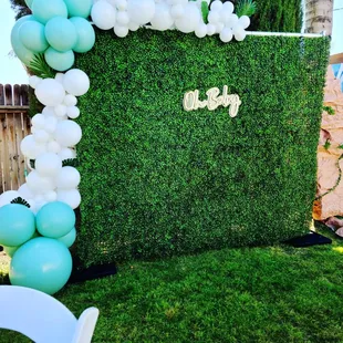 Greenery Wall in 7 ft x 7 ft. Also Featured is Our Oh Baby Neon Sign, &amp; Balloon Garland.