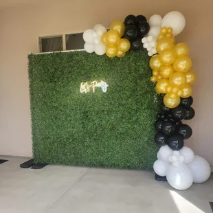 Graduation Party Featuring Our 7 ft x 7 ft Greenery Wall, Let's Parry Neon Sign &amp; Balloon Garland.
