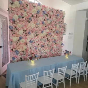 Keily Flower Wall Featuring Kids Tables, Kids Chiavari Chairs, Custom Made Centerpieces, and Light Blue Table Cloths.