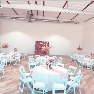 Set-Up at The Collective. 60in Round Tables, Ivory Linen, &amp; White Resin Chairs provided by Us.