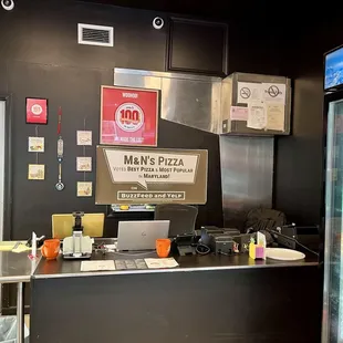 a man's pizza counter