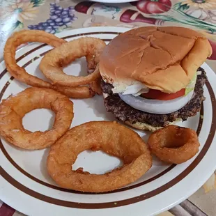 a hamburger and onion rings