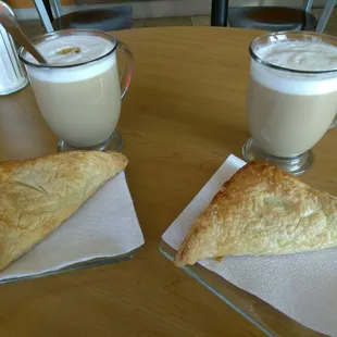 two pastries and a glass of milk