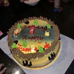 a birthday cake with cars on it