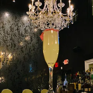 a chandelier and a glass of champagne