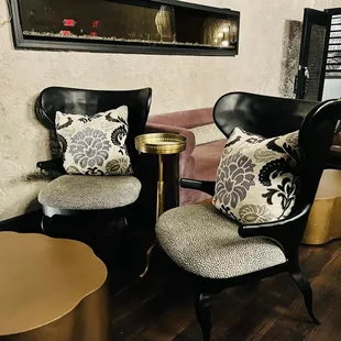 two chairs and a table in a living room