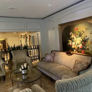 a living room with couches and chairs
