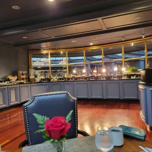 a view of a dining area with a table and chairs