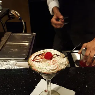 a person serving a dessert
