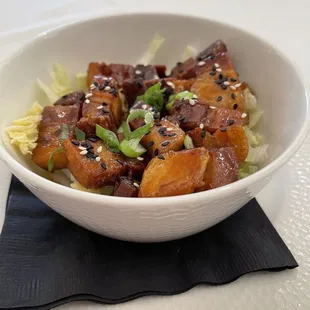 Pork Belly Bites - tasty!  I like that they&apos;re served on Napa cabbage