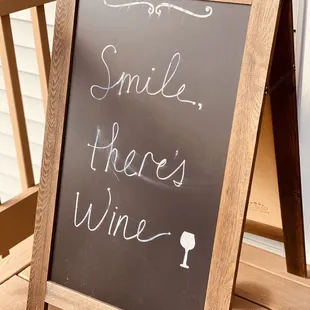 a chalk board with a wine glass on it
